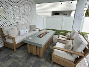 Comfortable outdoor Fire Table set, seating for 5 and outdoor Kitchen Aid grill with tools