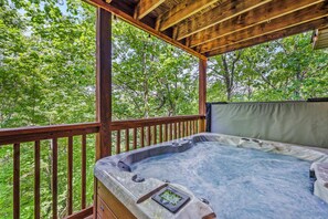 Hot tub is located on the main deck and is accessible from 2 doors