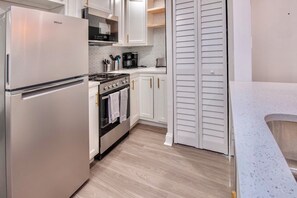 Stay Fresh, Dine in Style 🍴❄️ Experience comfort and convenience with our Airbnb's modern kitchen and generously-sized refrigerator.