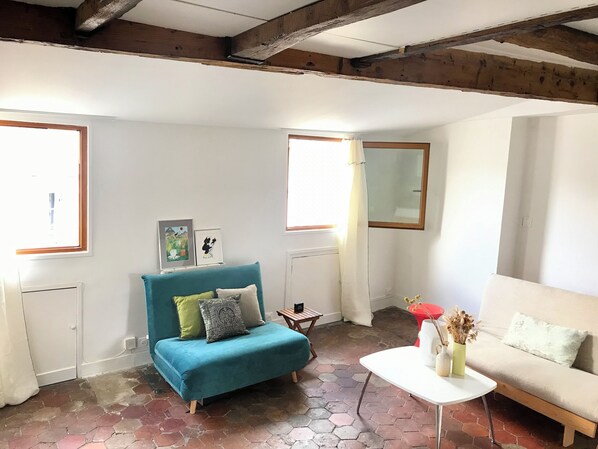 Living room with Original exposed wooden beams with beautiful city skyline view.