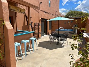 Have fun on the private patio with jacuzzi, tiki bar and table with seats!