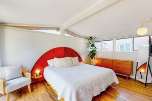 Master bedroom with extra comfortable designer king bed and dresser.