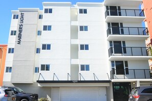 Front of building with garage underneath