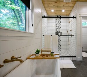 Enjoy our large bath tub with a tray for your favorite book and beverage.