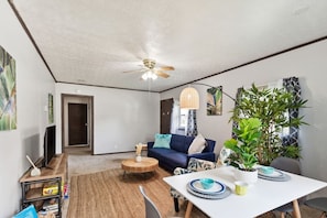 The open front room and dining area is homey yet stylish.