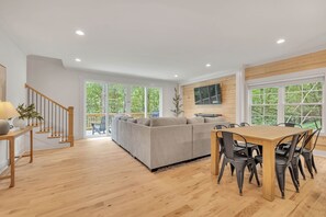 Living room and 8-person kitchen table.