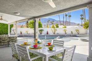 The large outdoor table with seating for six is ideal for enjoying dinner al-fresco