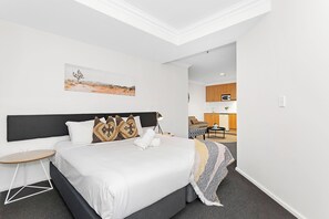 Unwind in this spacious bed, featuring a comfortable bed and stylish decor. It's the perfect place to relax after a long day of exploring.