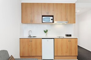Whip up a delicious meal in this well-equipped kitchenette, complete with a microwave and mini-fridge.