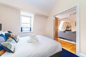 Spacious Bedroom with linen and towels provided