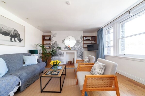 Beautifully decorated living area, with dinning table.