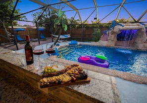Kids & teens will love this pool with a sculptural waterfall and a 6-person spa.