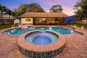 Savor the vibrant Florida sunsets as you unwind in the steaming spa.