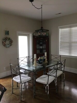 Dining area with a table for 6.  Additional seating for 2 at the kitchen bar.