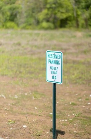 Assigned Parking. Additional parking in the grass near parking lot. 
