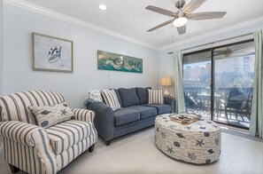 Living room with queen sleeper sofa.  Step outside for a great view. 