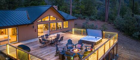Deck with hot tub, fire pit, seating area and grill