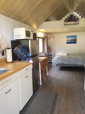 Kitchenette, apartment size fridge and a drop leaf table