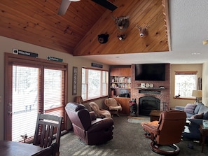 Livingroom with woodburning fireplace.