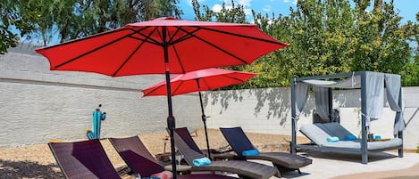 Poolside loungers and cabana