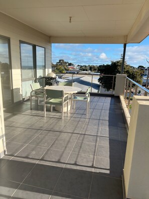 upstairs balcony, with med Webber 
An extra 6 plastic chairs are avail.