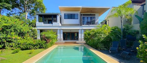 View from the end of the pool of the private back yard and patios!  