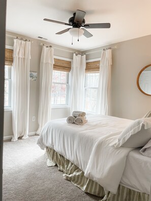 Cozy bedroom with soft light, plush bedding, and peaceful vibes for restful nights.