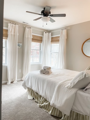 Cozy bedroom with soft light, plush bedding, and peaceful vibes for restful nights.