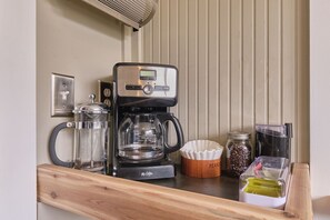 Your morning coffee is eagerly awaiting preparation, crafted from locally sourced and organic coffee beans.