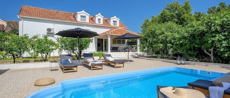 Croatia luxury family villa Essencia Milna Brac with private heated pool for vacation and rent 