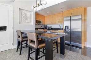 Well equipped kitchen with large fridge/freezer and area to sit comfortably