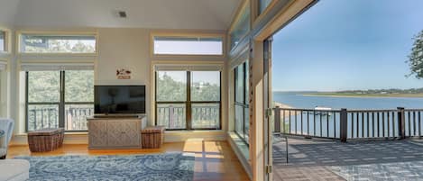 Double french doors in the living room open to the huge back deck.