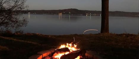 Fire pit view of the Lake at night