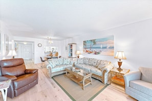 A summer-themed living room that complements the ocean view.