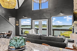 Gorgeously appointed living room with comfortable seating and lake views!