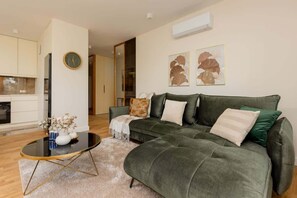 Another angle of the living room, emphasizing the open-plan layout and stylish furniture.

