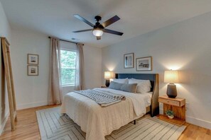 Guest bedroom #1 with a queen sized bed. Bathroom is shared with the bunk room.