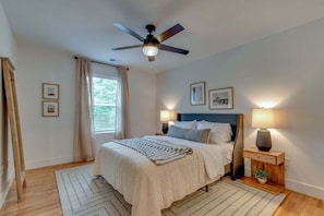 Guest bedroom #1 with a queen sized bed. Bathroom is shared with the bunk room.