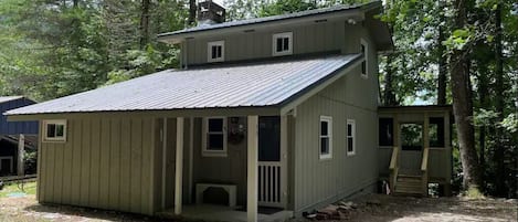 Recently updated with new paint, climate control, windows, & screened porch/deck