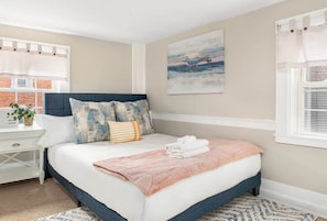 Bedroom 2: Retreat to our inviting guest bedroom furnished with a cozy memory foam queen bed.