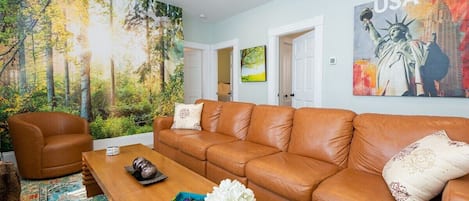 Comfortable living room featuring a plush sofa and Smart TV for entertainment, perfect for relaxation!