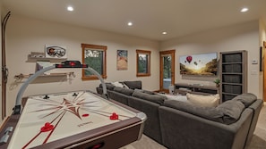 Family room on lower level with air hockey table