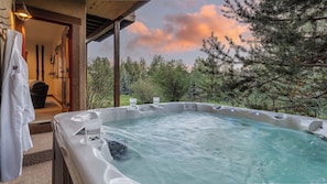 Soak in the private hot tub just steps away from the lower level family room