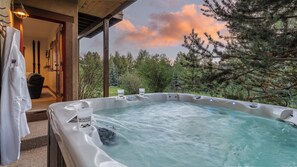 Soak in the private hot tub just steps away from the lower level family room