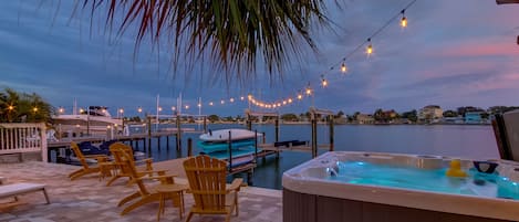Enjoy your private 7 person hot tub overlooking Dolphin Bay.
