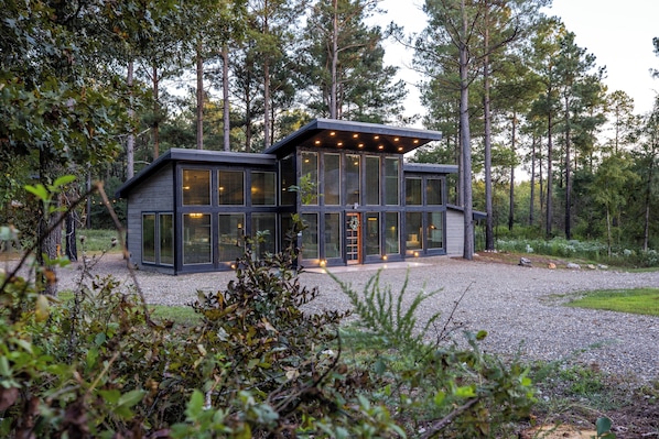 Front view of the Chardonnay Chalet.  Notice the entire front portion of the cabin is all glass to let in all the natural sunlight.  All the windows are also equipped with blinds when the time calls for more privacy.