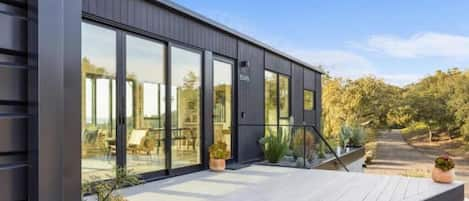 Modern, open-concept modular container home with 360 views, sunrise to sunset