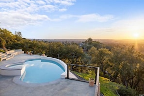 Solar-heated pool and hot tub overlook an endless expanse of oaks and the valley