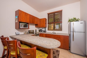 Open kitchen, stainless steel appliances, ocean views