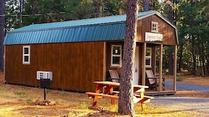 The cabin has a covered patio with chairs, a barbecue grill, and a private picnic table. You can relax and enjoy the stunning views of the forest, the mountains and sit by or swim in our freshwater swimming pond. The cabin is conveniently located where you can go fishing, rafting, kayaking, or hiking.